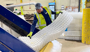 A Cassella worker recycling a mattress