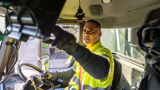 A Casella worker in a waste truck