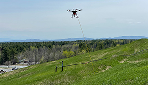 A drone flying over a landfill